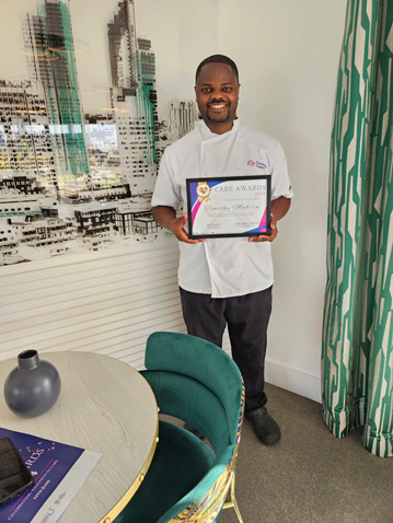 Timothy Mubiru with his certificate